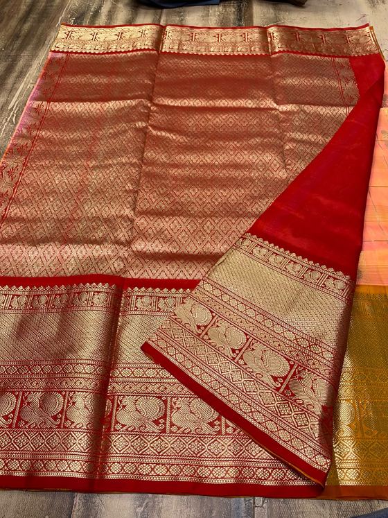 Kumkum red silk saree with gold zari brocade and peach body