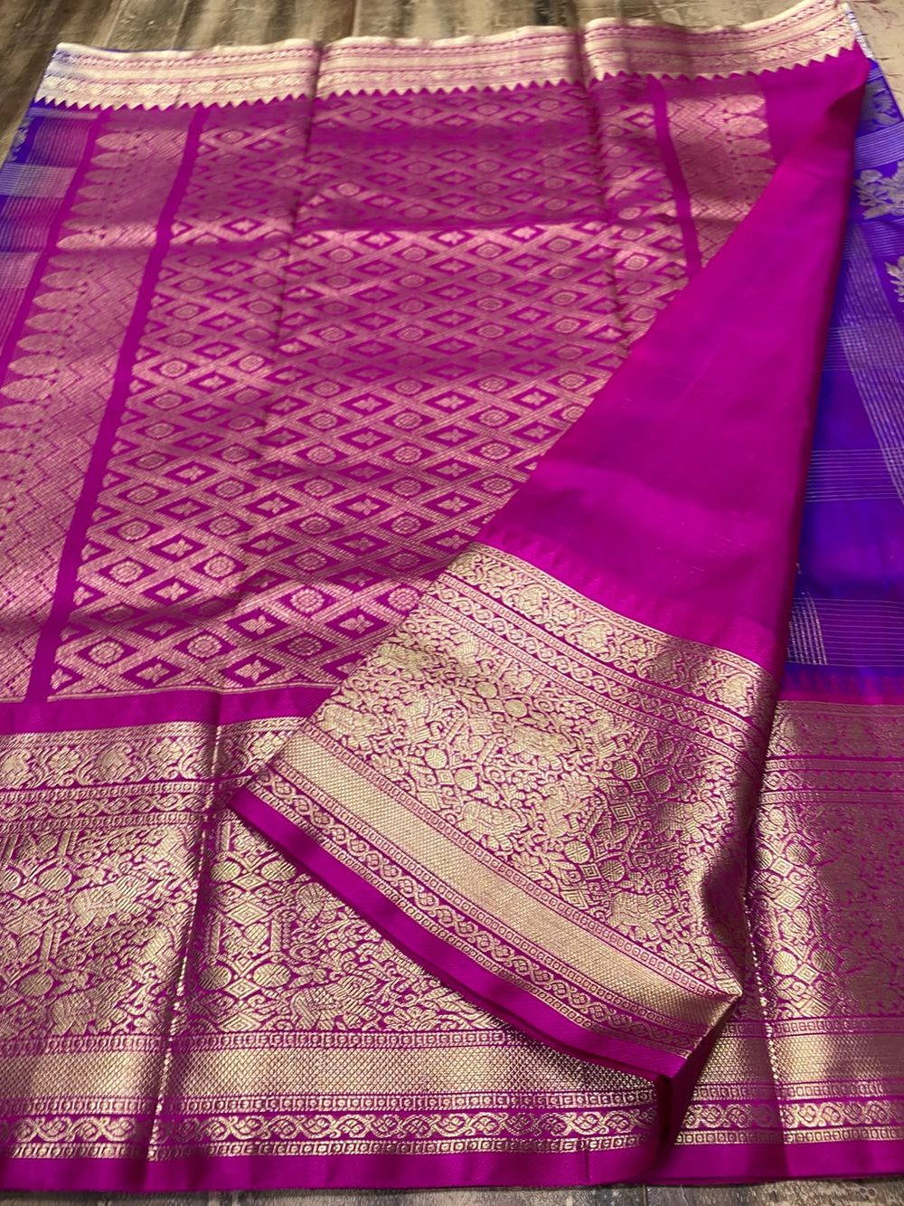 Magenta silk saree with gold zari brocade and violet body