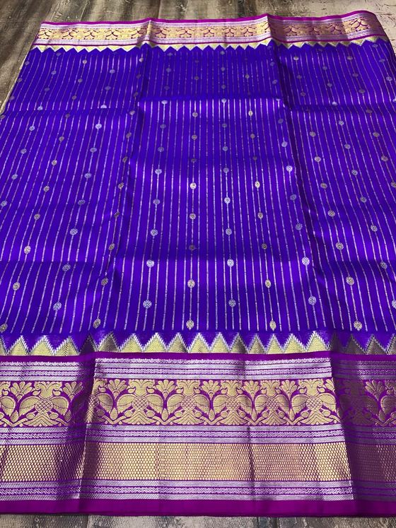Violet silk saree with silver stripes and buttis, magenta and gold border